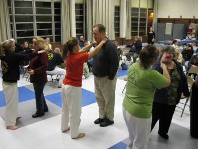 Instructors from Norfolk Karate Academy coach civic league members in self-defense moves at the January 9th, 2012 Suburban Acres Civic League Meeting.